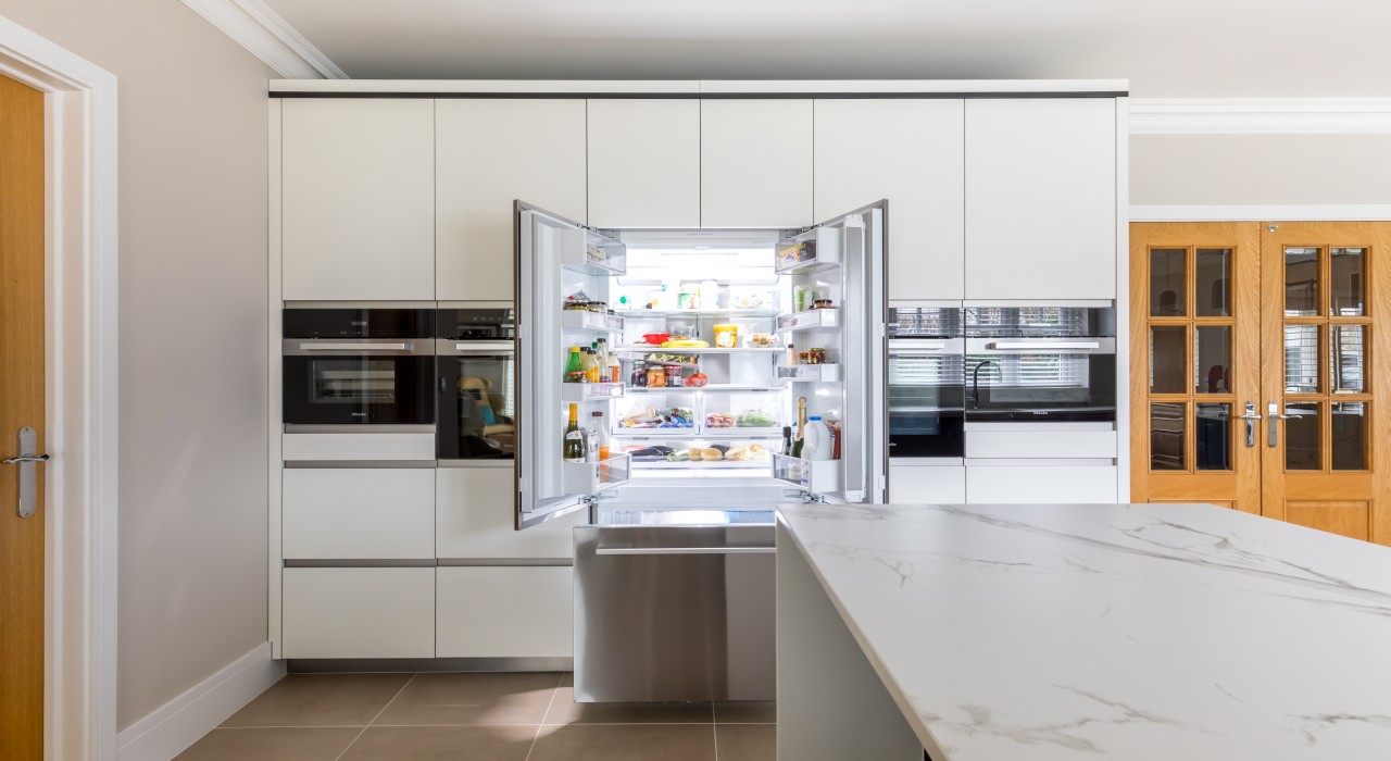 Large fridge freezer open in kitchen