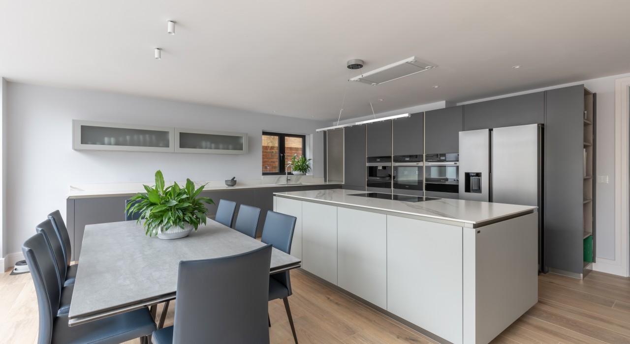 Kitchen with large table and chairs and central island