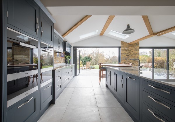 Dark kitchen furniture and bi-fold doors