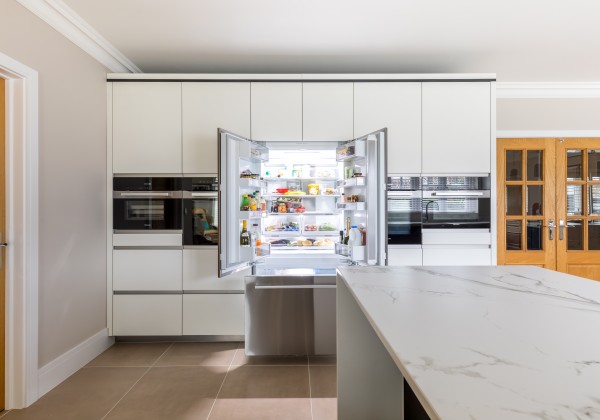 Large fridge freezer open in kitchen