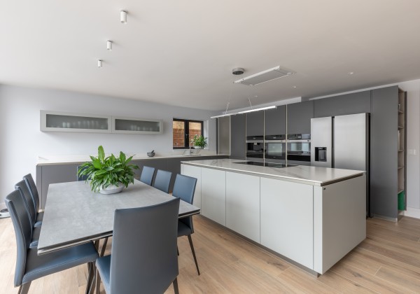 Kitchen with large table and chairs and central island